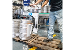 Image Person working with kegs.